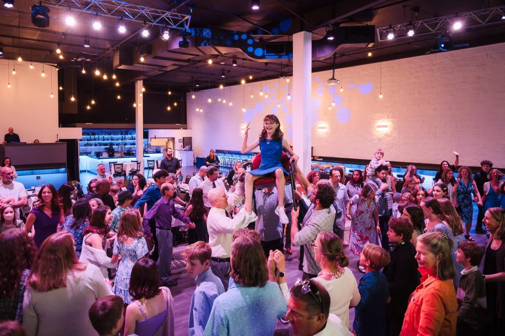Guests celebrating the hora in Nissi’s event room