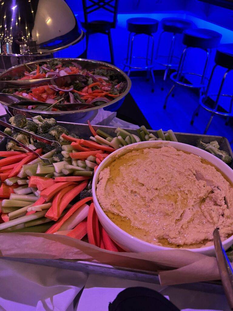 Salad, vegetables and dip on a buffet beside Nissi’s bar