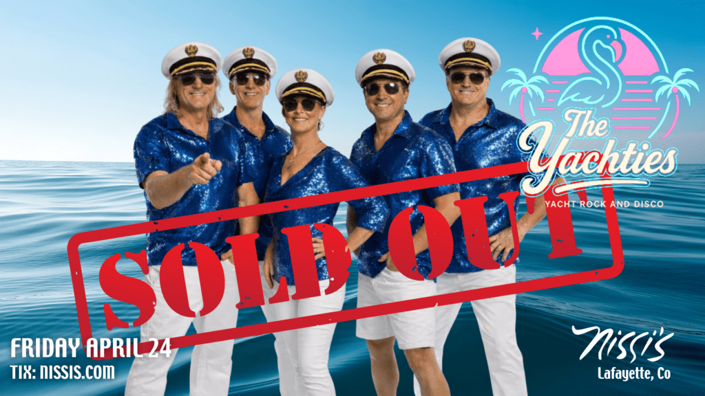 Five people in captain hats and blue shirts pose together on an ocean backdrop with a large red SOLD OUT stamp across the image, indicating a sold-out event poster.
