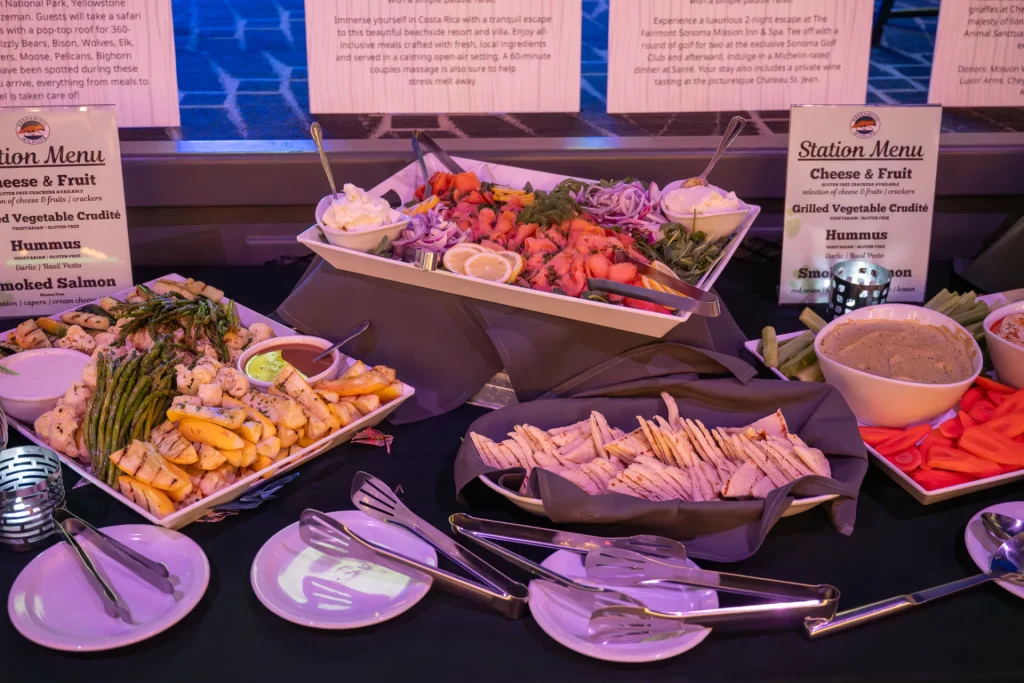 Platters of fruit, cheese and vegetables arranged at a catering station