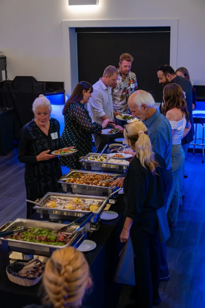 Guests serving themselves at a catered buffet at Nissi’s