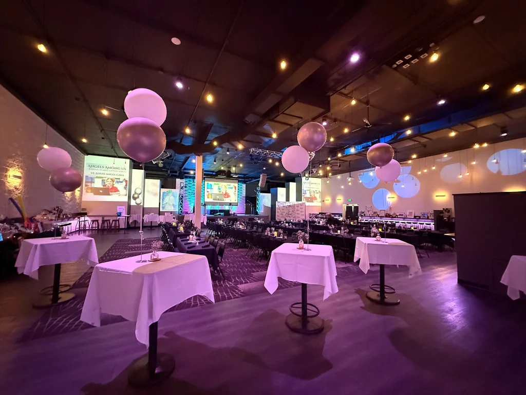 Nissi’s room arranged with tables and hanging balloon decorations
