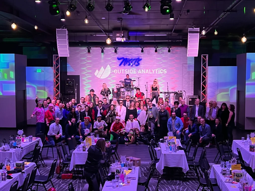 Company holiday party guests gathered on Nissi’s stage