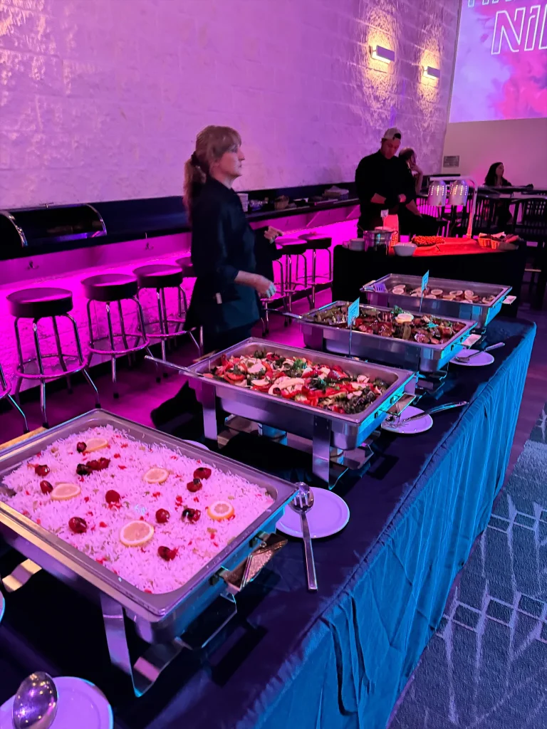 Catering trays and service staff during a mitzvah at Nissi’s